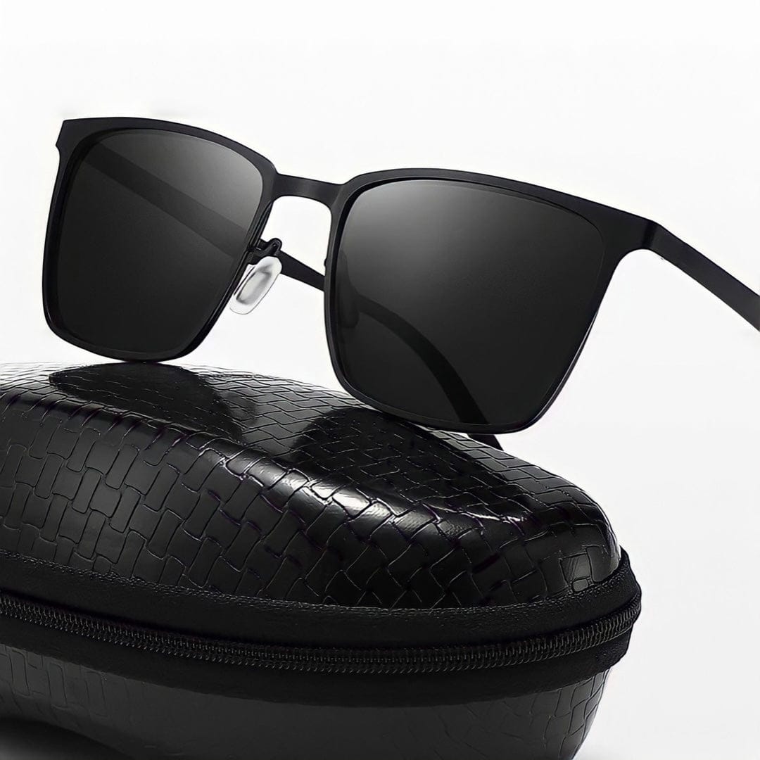 Close-up of square metal frame sunglasses on a zip case