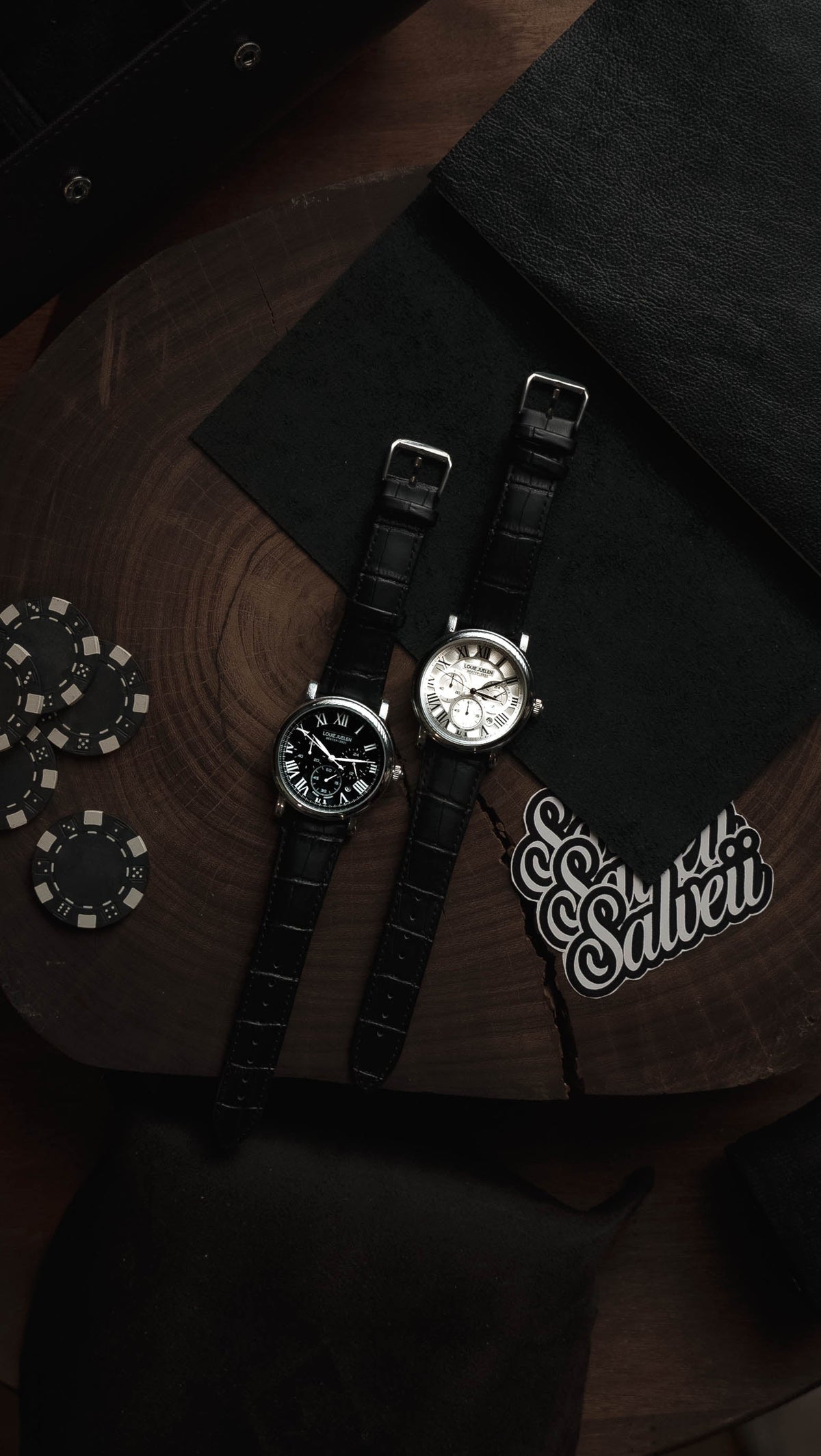 Roman numeral dress watch on a dark surface