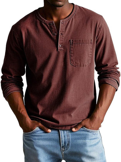 Man wearing a burgundy chest pocket henley shirt