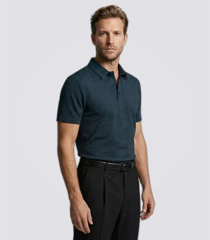 Man wearing a navy basketweave knit polo shirt