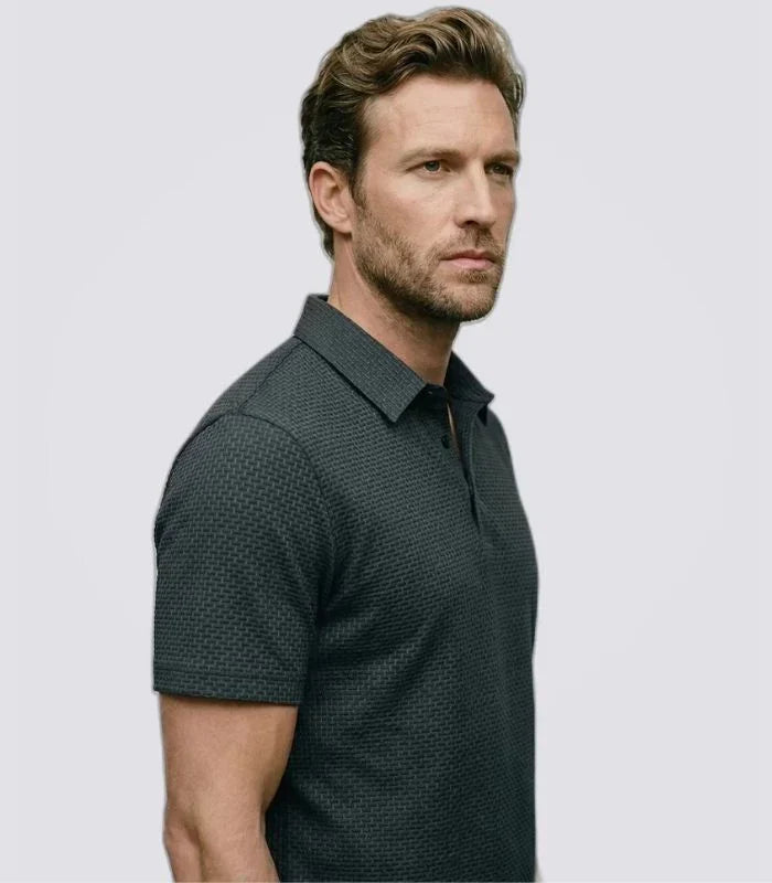 Man wearing a dark green basketweave knit polo shirt, side view