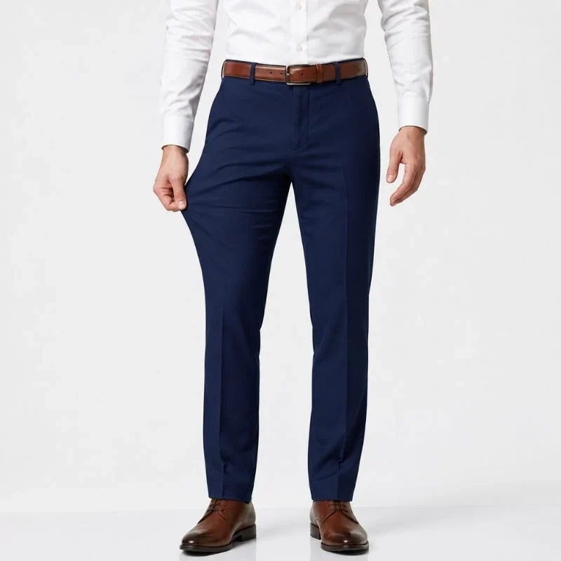 Navy blue slim-fit stretch dress pants with a white shirt and brown belt, front view