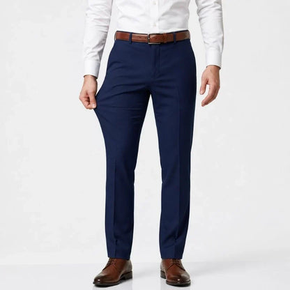 Navy blue slim-fit stretch dress pants with a white shirt and brown belt, front view