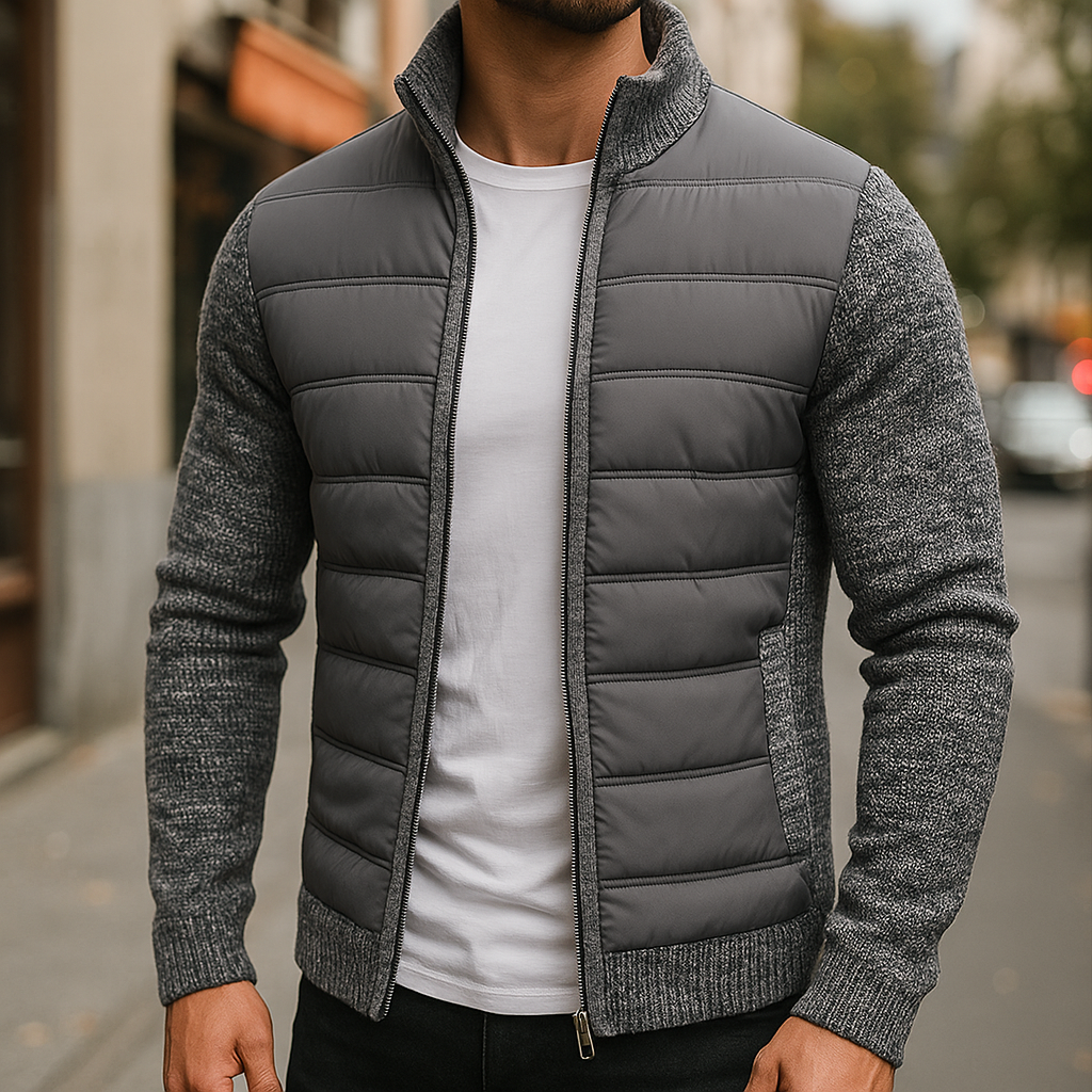 Dark gray quilted hybrid jacket with knit sleeves over a white T-shirt