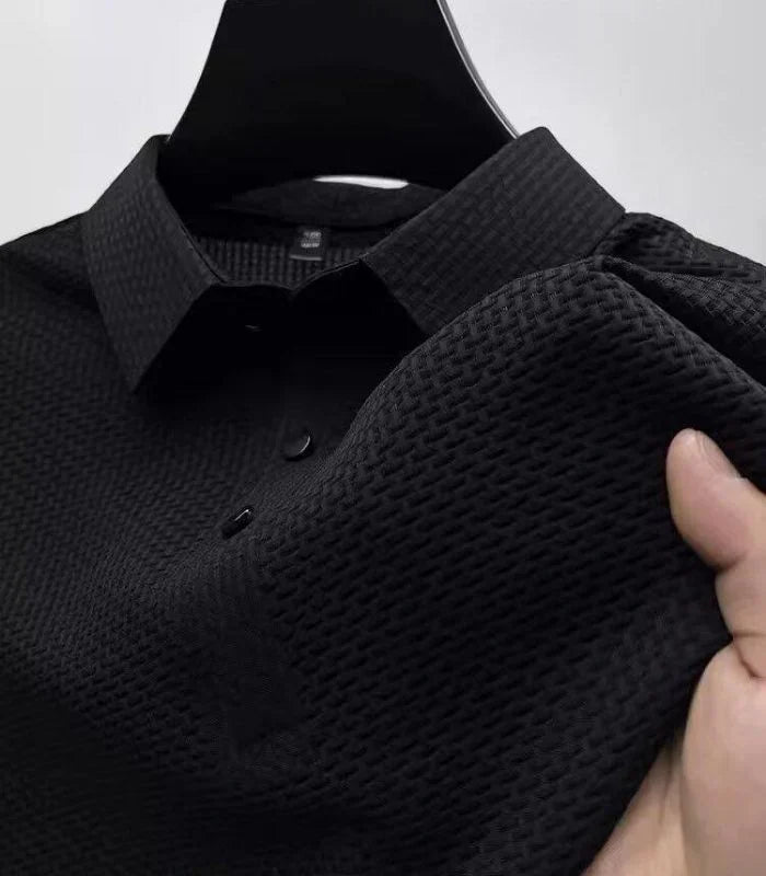 Black basketweave knit polo shirt, close-up