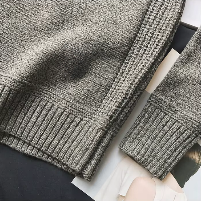 Ribbed cuff of the gray sweater