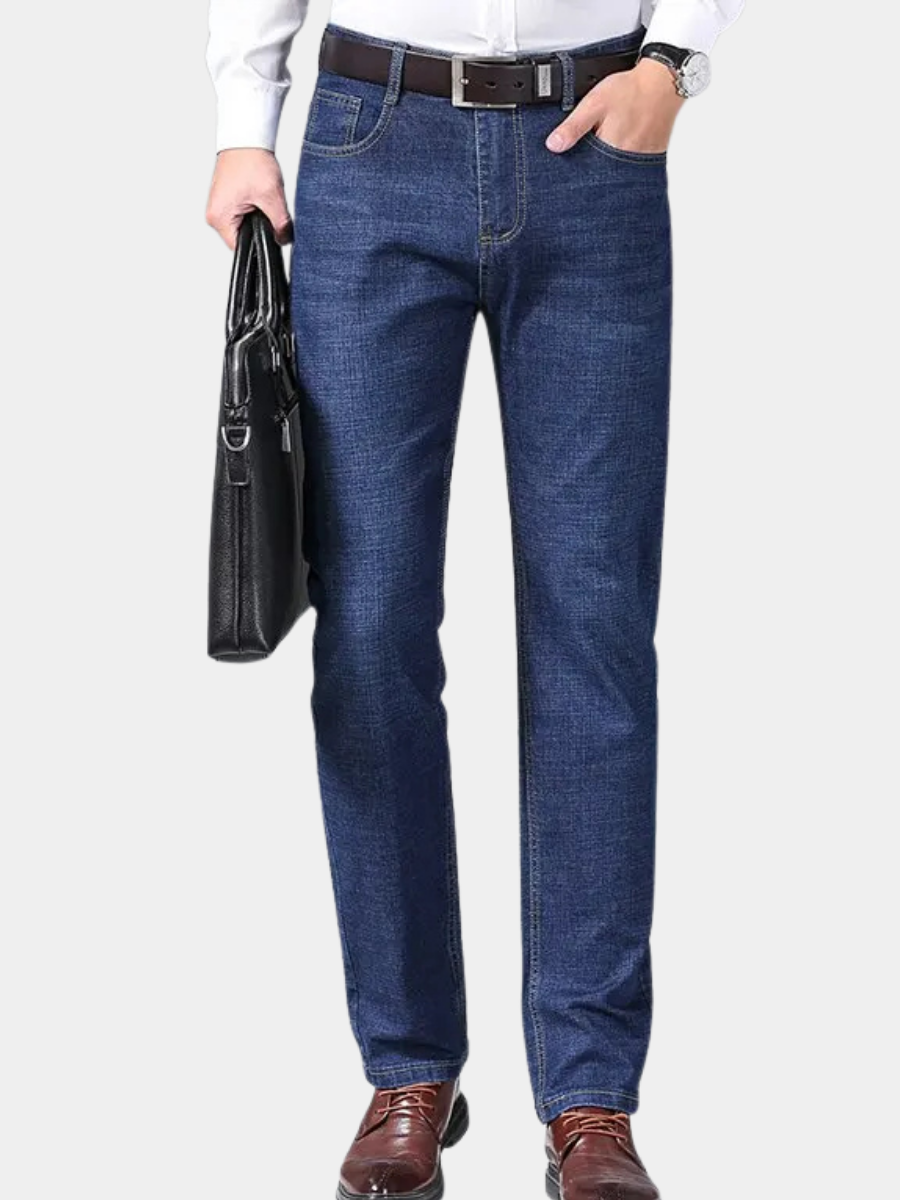 Blue slim-fit five-pocket jeans worn with a light shirt