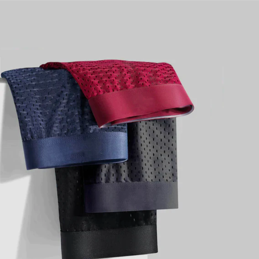 Mesh boxer briefs hanging in several colors