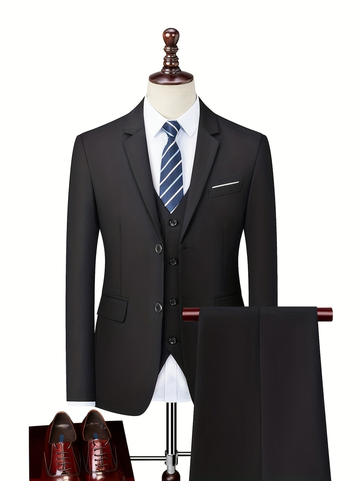 Black suit shown on a mannequin with a vest, white shirt and striped tie