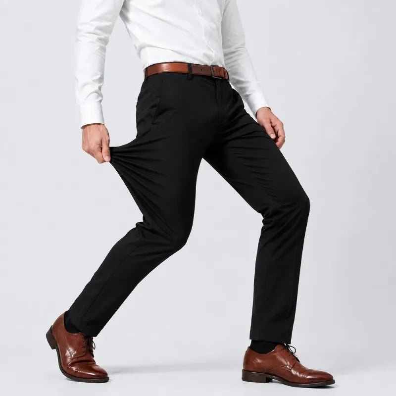 Black stretch dress pants pulled at the leg to show the stretch of the fabric