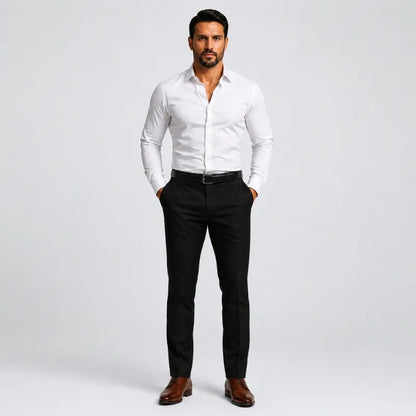 Man wearing black slim-fit stretch dress pants and a white shirt, full-length front view
