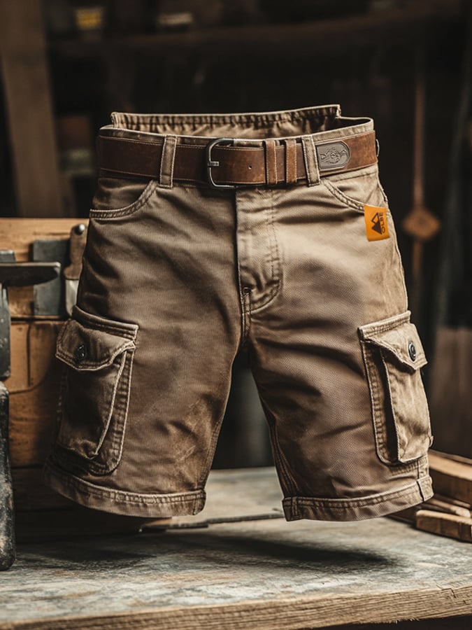Khaki utility cargo shorts on a wooden table
