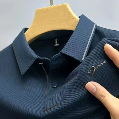 Navy blue waffle-knit polo shirt close-up of collar and placket