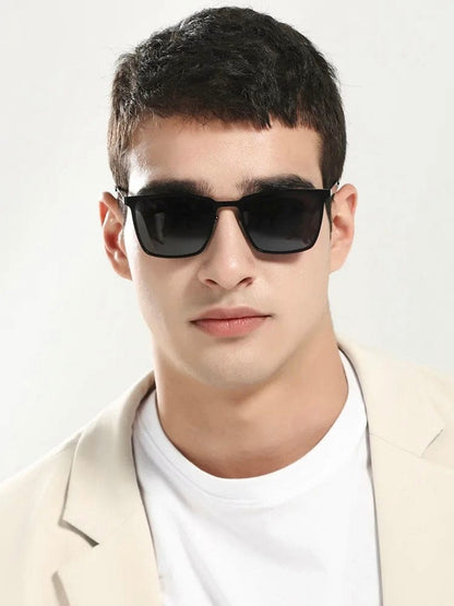 Man wearing black square metal frame sunglasses