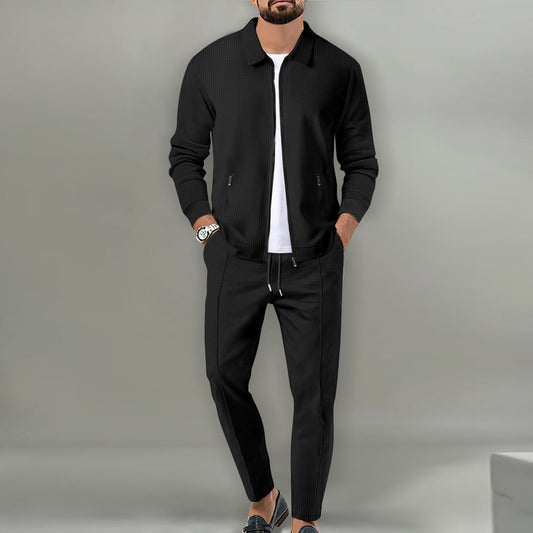 Black waffle-knit zip jacket and drawstring pants set worn over a white T-shirt
