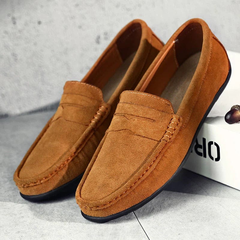 Pair of brown suede penny loafers with rubber nub sole