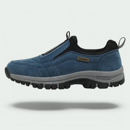 Blue slip-on lug-sole walking shoe from the side