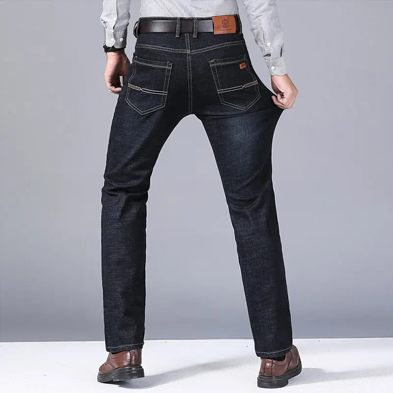 Black slim-fit five-pocket jeans worn, back view