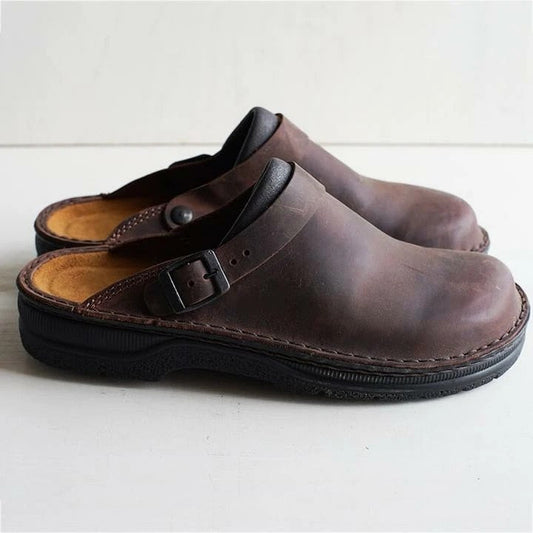 Pair of brown buckle-strap clog slippers