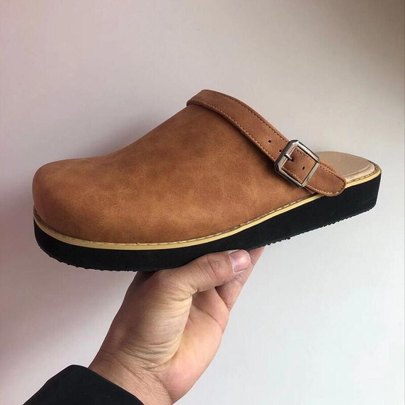 Brown buckle-strap clog slipper from the side