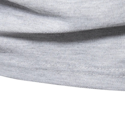 Close-up of the stitched hem on the gray polo shirt
