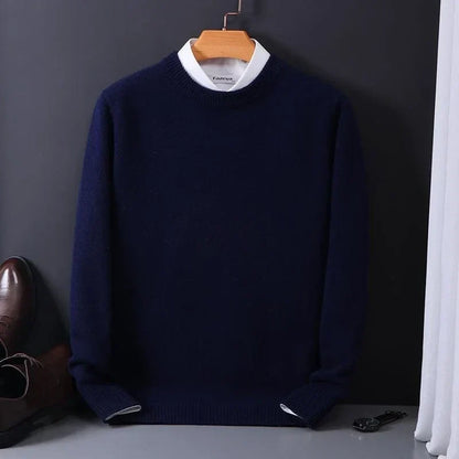Navy blue fine-knit crew neck sweater on a hanger