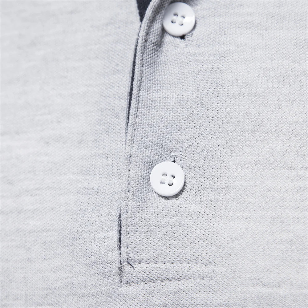 Close-up of the two-button placket on the gray polo shirt