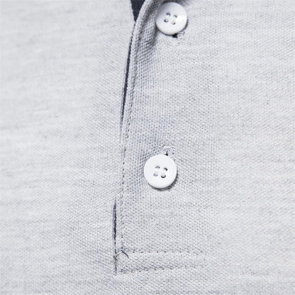 Close-up of the two-button placket on the gray polo shirt
