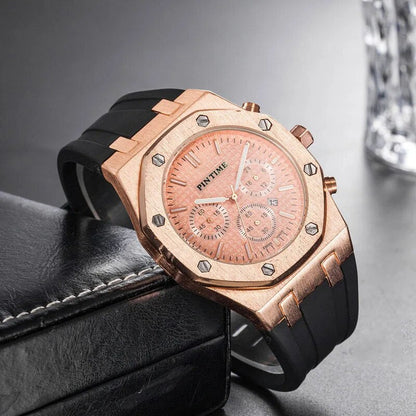 Rose gold octagonal chronograph watch on a dark surface