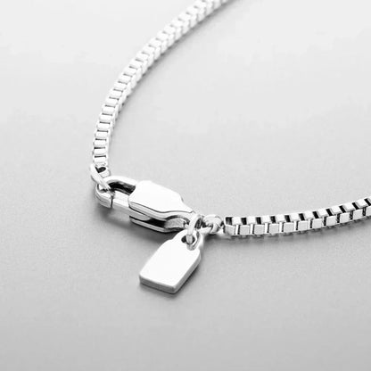 Lobster clasp and tag of the fine box chain necklace