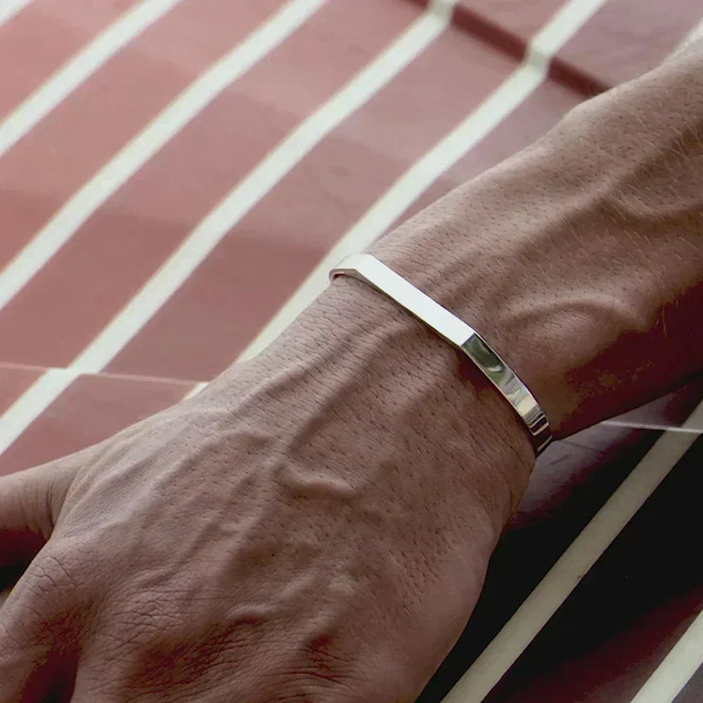 Angular open cuff bracelet worn on the wrist