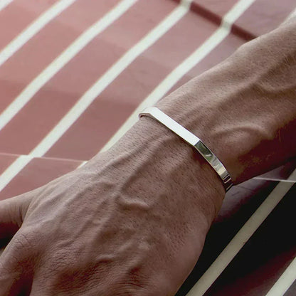 Angular open cuff bracelet worn on the wrist