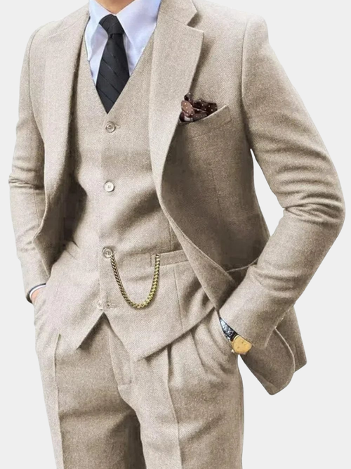 Man wearing a beige herringbone notch-lapel suit