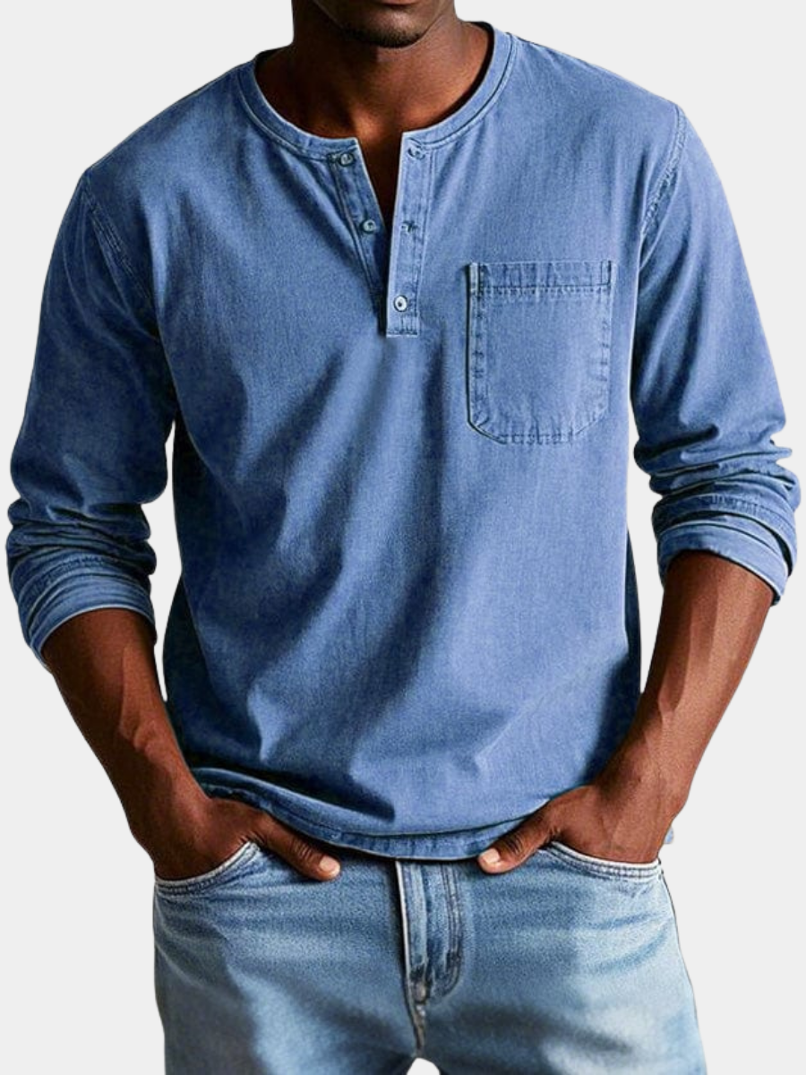 Man wearing a blue chest pocket henley shirt