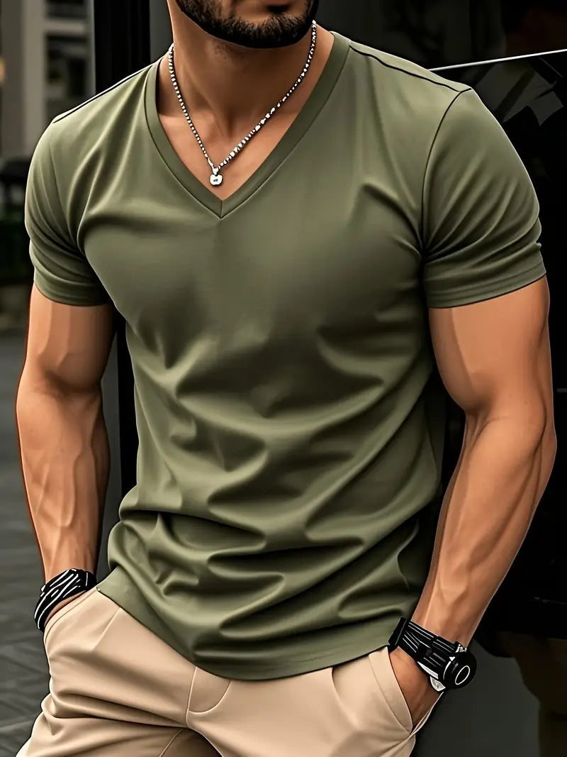Green slim V-neck T-shirt worn with beige trousers