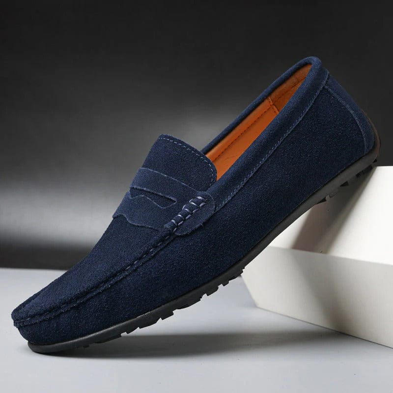 Navy blue suede penny loafer, side view