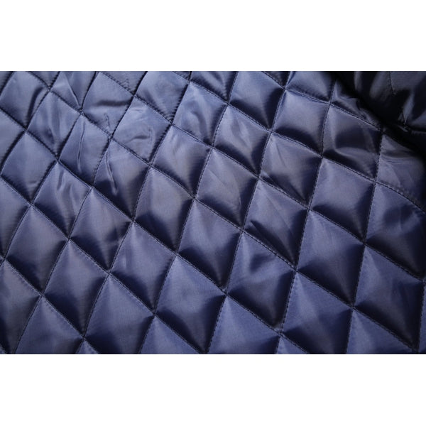 Diamond-quilted lining of the overcoat