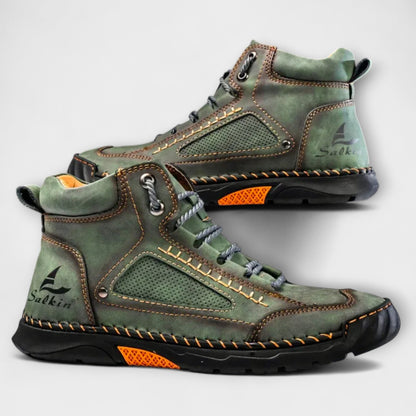 Pair of green lug-sole stitched ankle boots