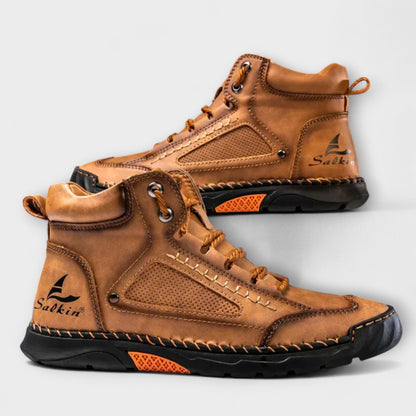 Pair of tan lug-sole stitched ankle boots