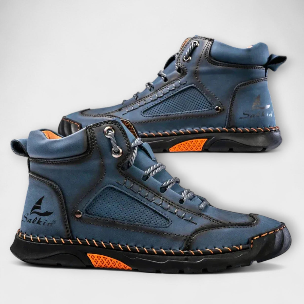 Pair of blue lug-sole stitched ankle boots
