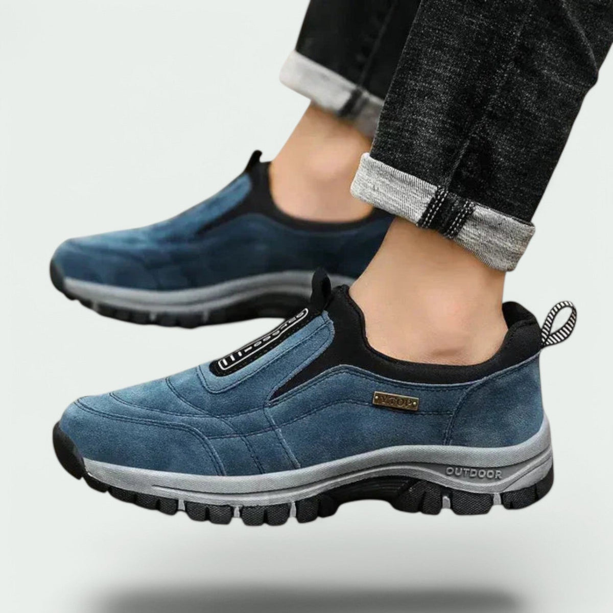Man wearing blue slip-on lug-sole walking shoes